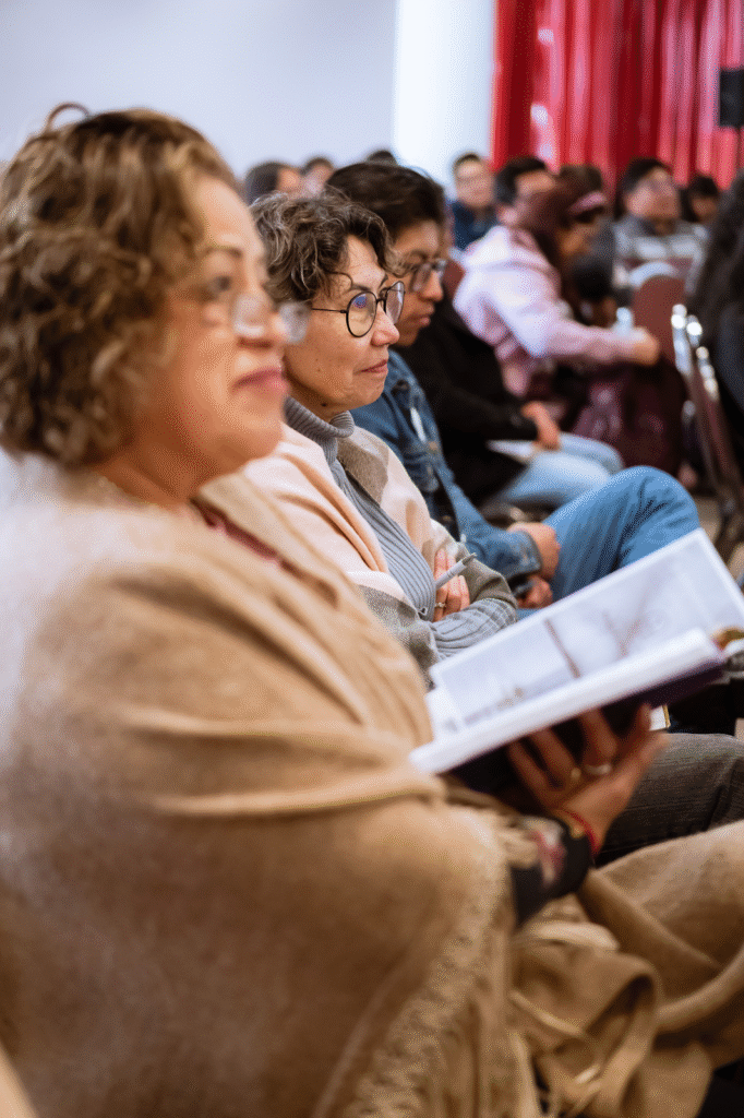Group of people sitting and listening