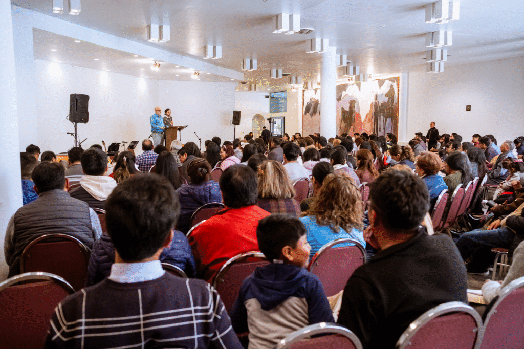 People listening to a speaker