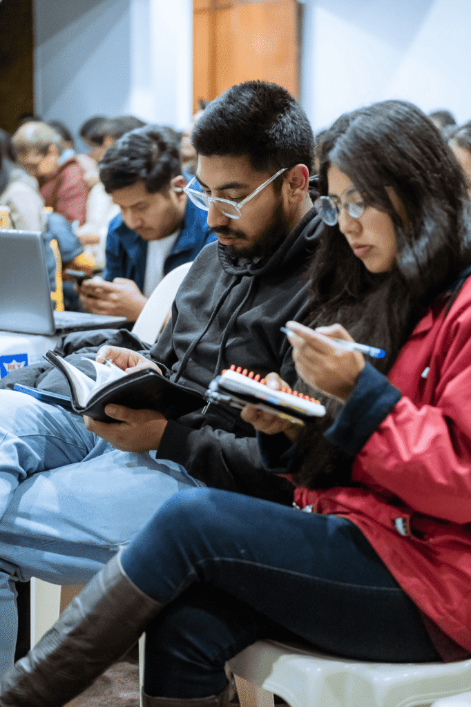 People reading and taking notes